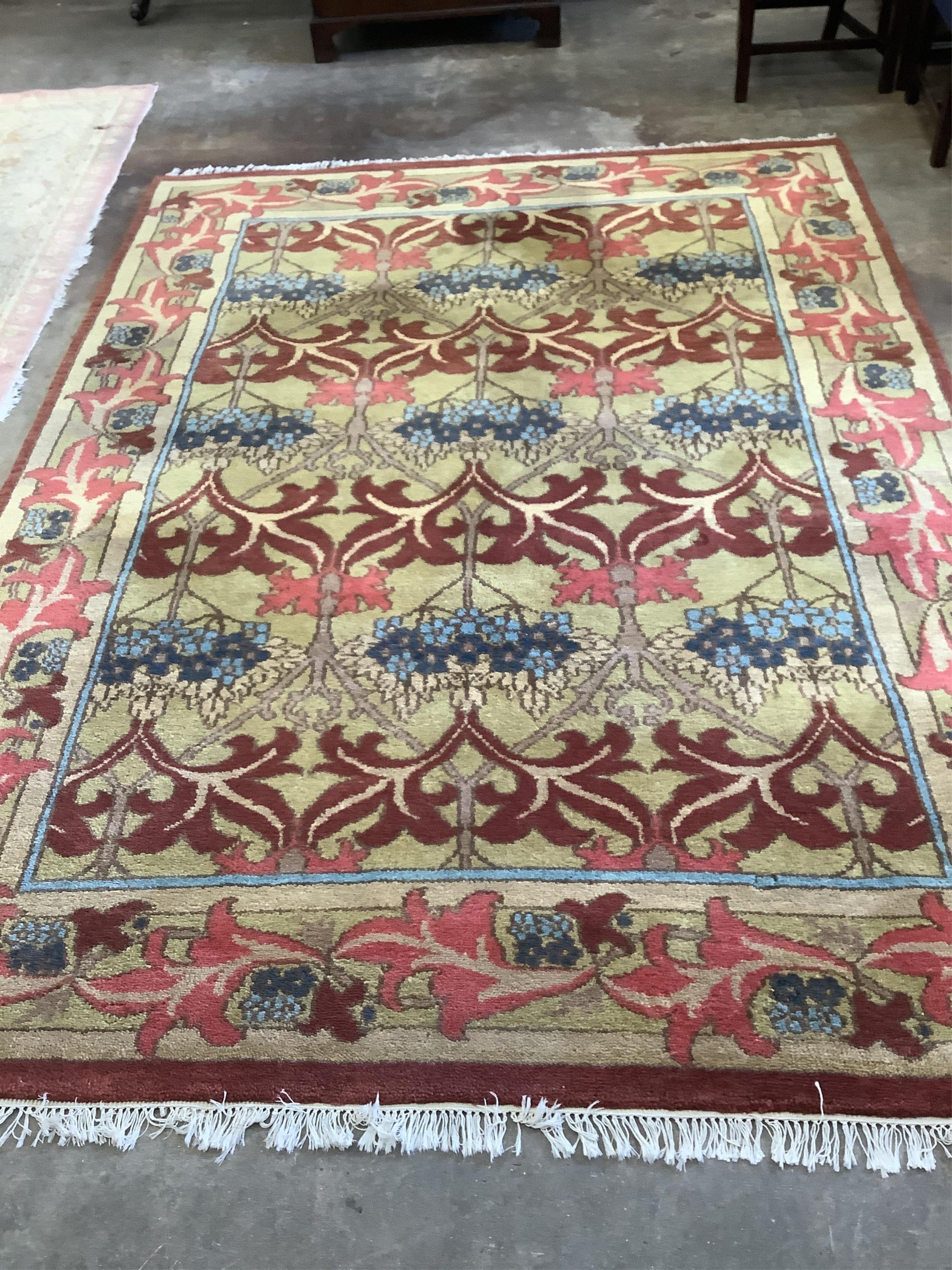A modern Arts & Crafts style carpet, purchased from Liberty, 310 x 220cm. Condition - good